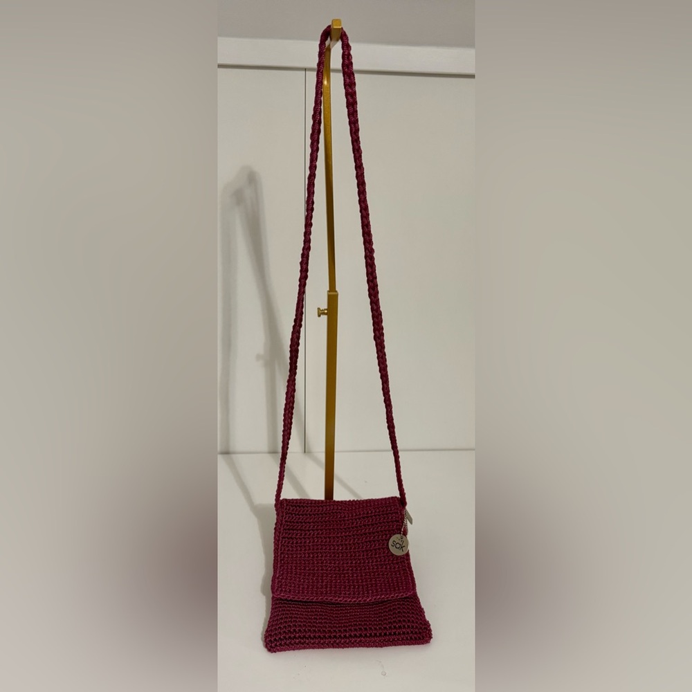 The Sak Pink and Silver Crochet Woven Crossbody Bag